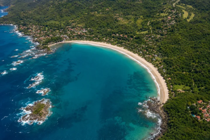 Aerial view of a turquoise cove on Guanacaste's Gold Coast, Costa Rica